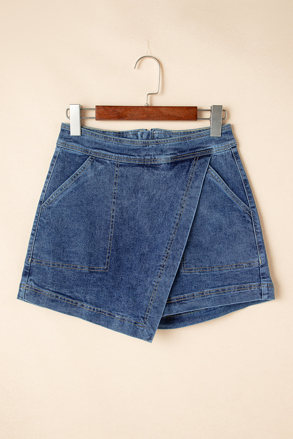 "Classic Denim mini skort front view on hanger — faux wrap crossover skort Freedom Fulfillment"